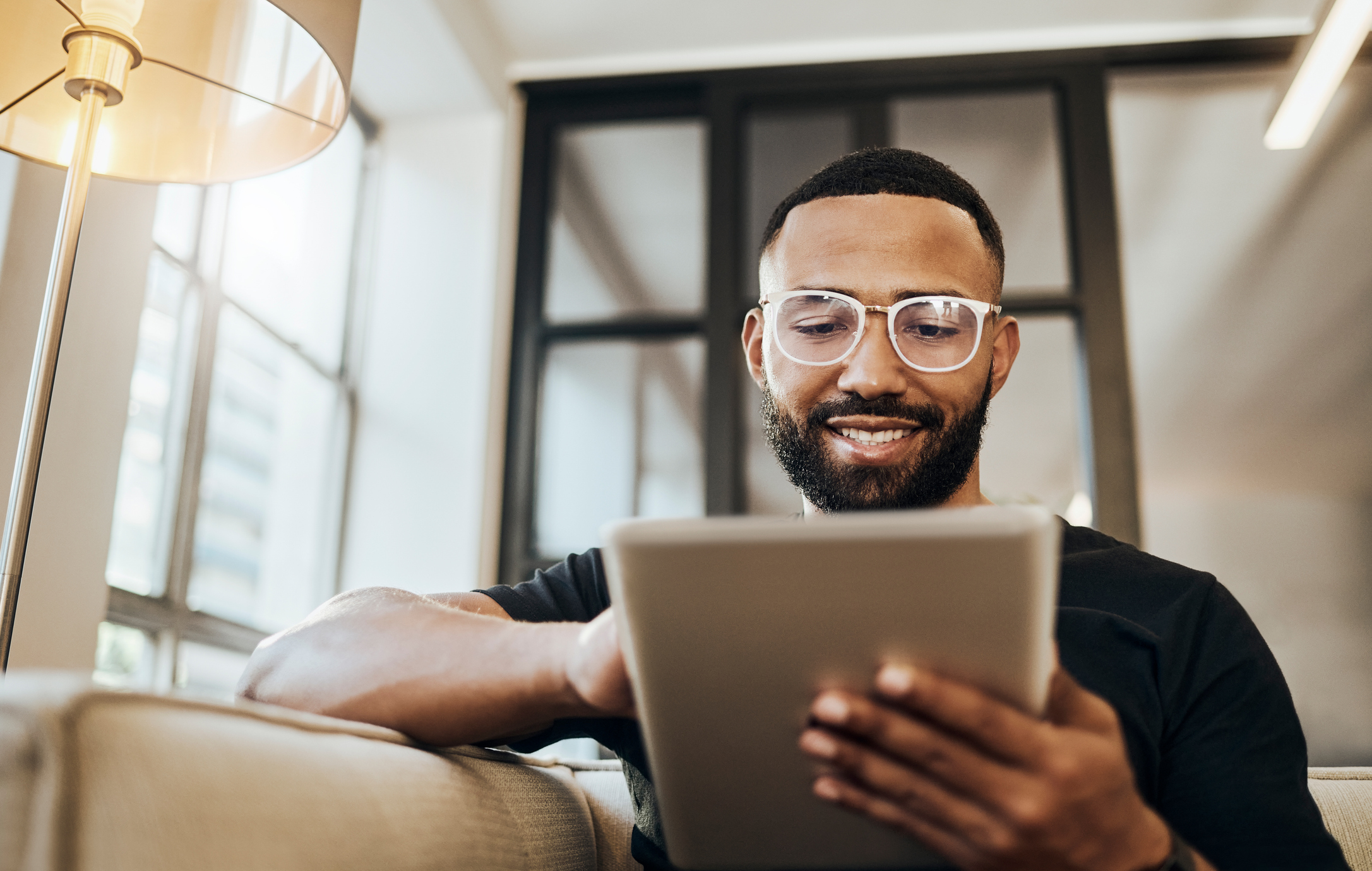 Black man, tablet and smile for social media post, shopping online or browsing internet